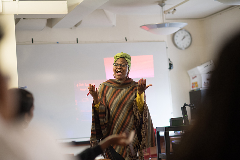 Photo of a smiling teacher in a classroom